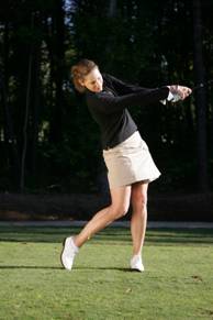 The left arm folds on the follow-through.